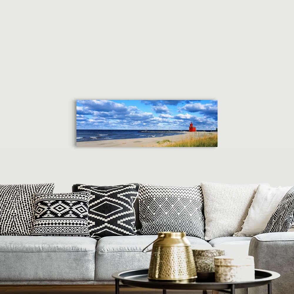 A bohemian room featuring Panoramic photograph of a large lighthouse next to a dock on a sandy beach in Holland, Michigan d...