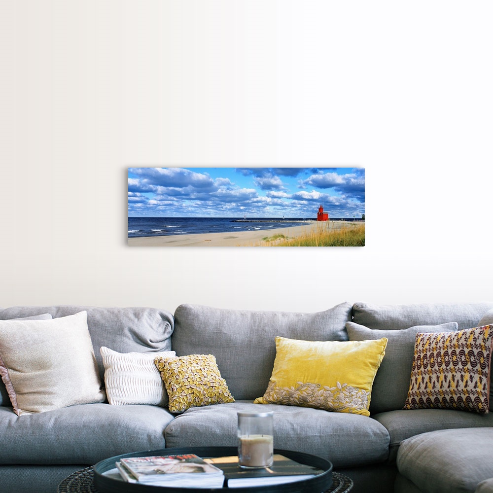 A farmhouse room featuring Panoramic photograph of a large lighthouse next to a dock on a sandy beach in Holland, Michigan d...