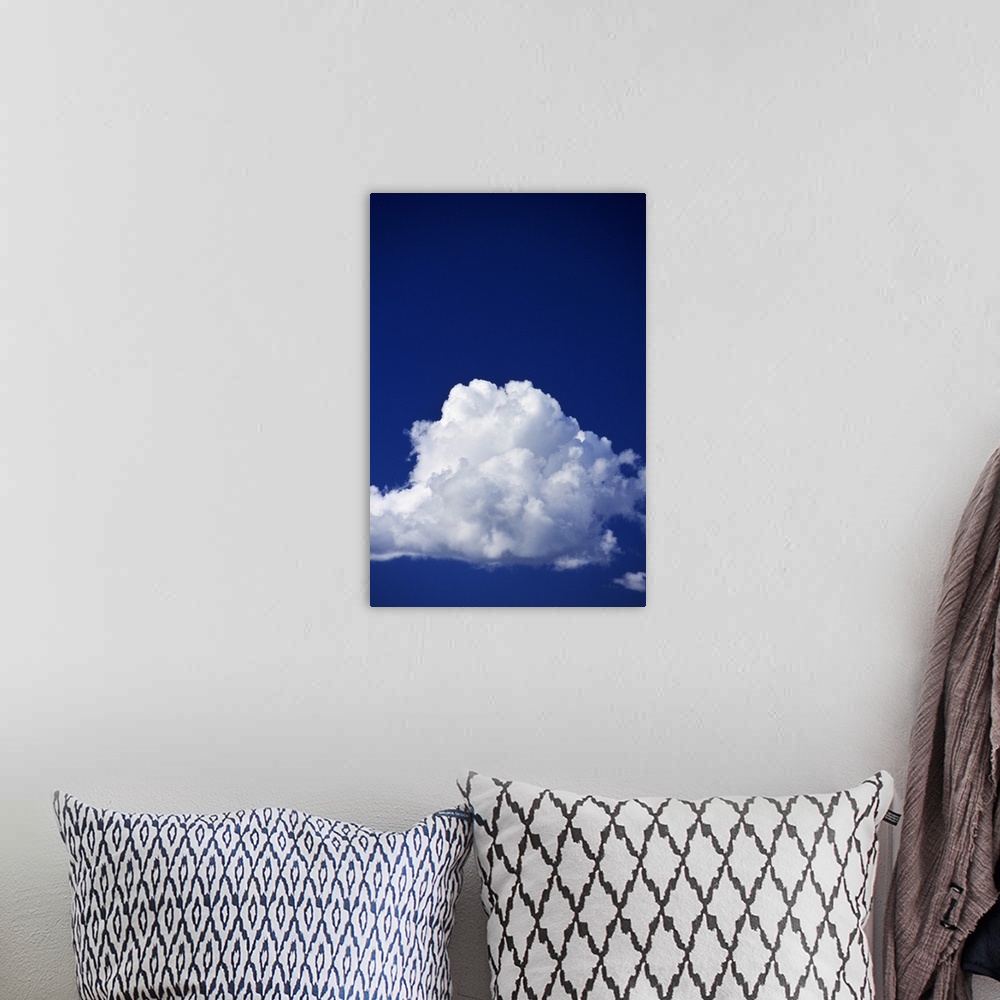 A bohemian room featuring Billowing white cloud, blue sky.