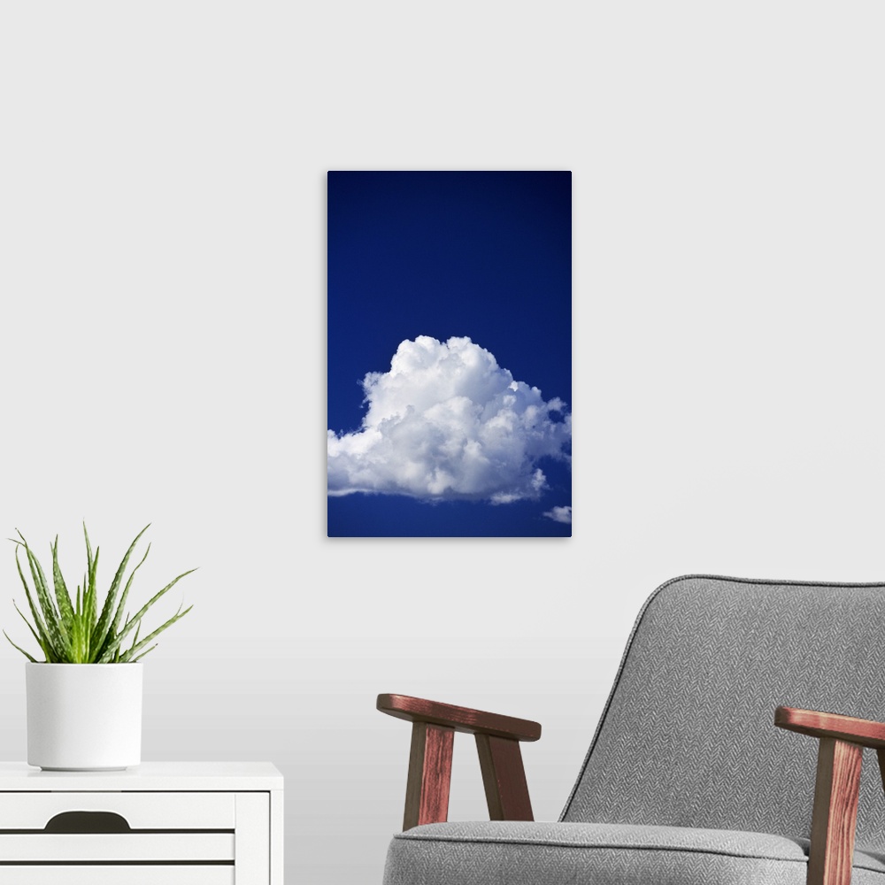 A modern room featuring Billowing white cloud, blue sky.