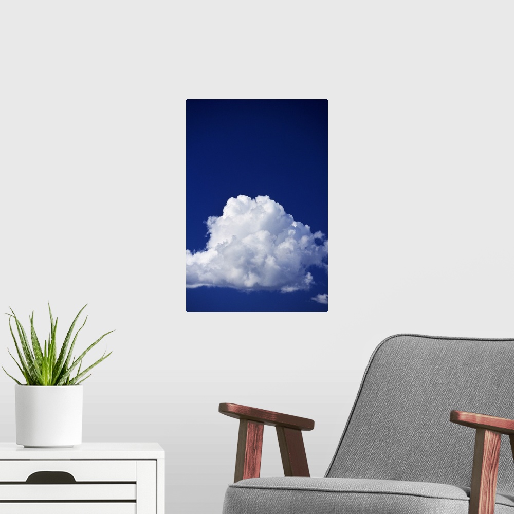A modern room featuring Billowing white cloud, blue sky.