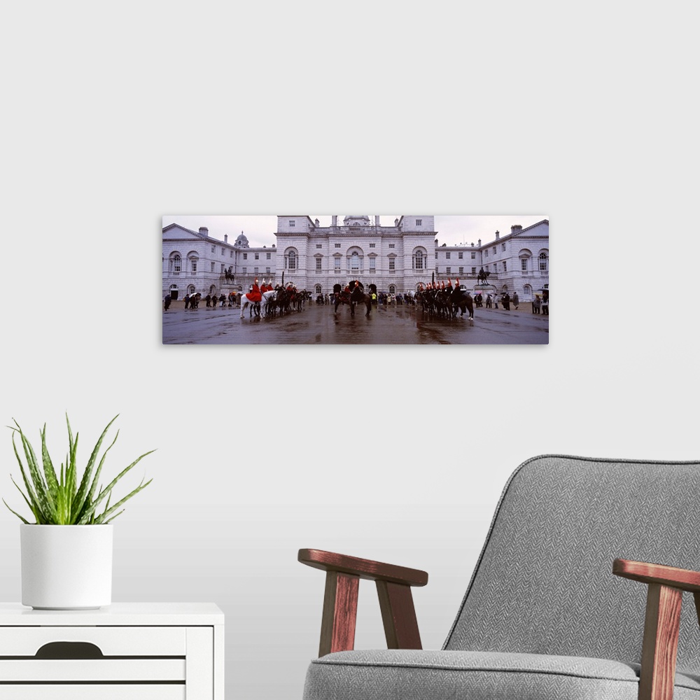 A modern room featuring Black horse guards in front of a building, London, England