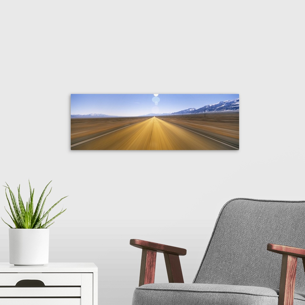 A modern room featuring Blurred Road NV