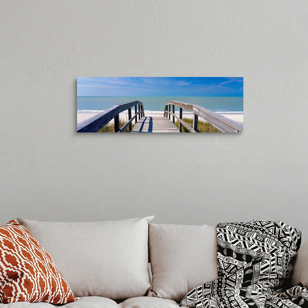 A bohemian room featuring Wall art for the home or office this panoramic photograph shows a boardwalk over dunes to a sandy...