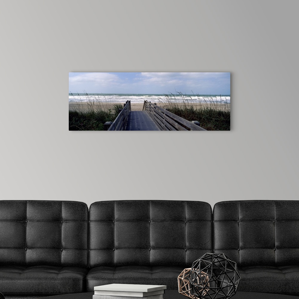 A modern room featuring A wide panoramic photograph on canvas perfect for hanging in a living or dining room of a view do...