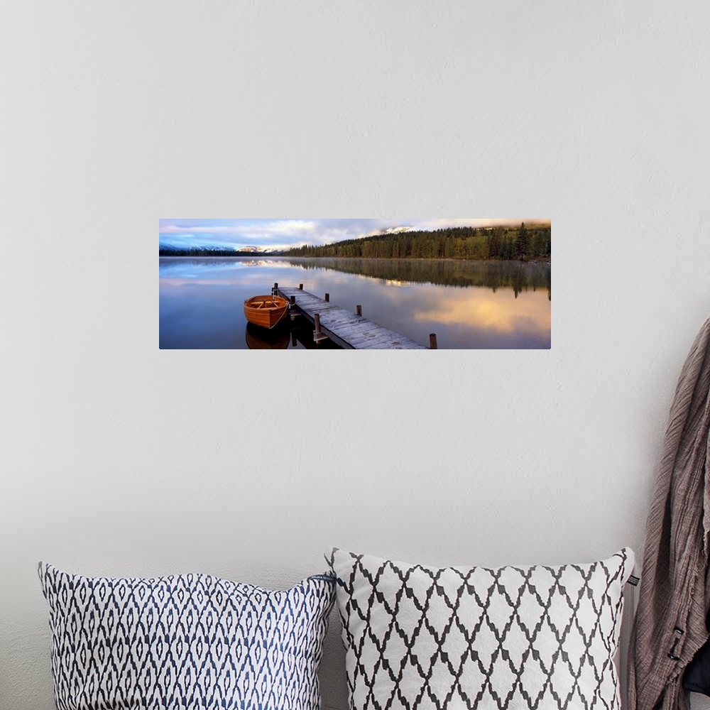 A bohemian room featuring Panoramic photograph of creek with canoe tied to a pier.  There are trees on both sides of the cr...