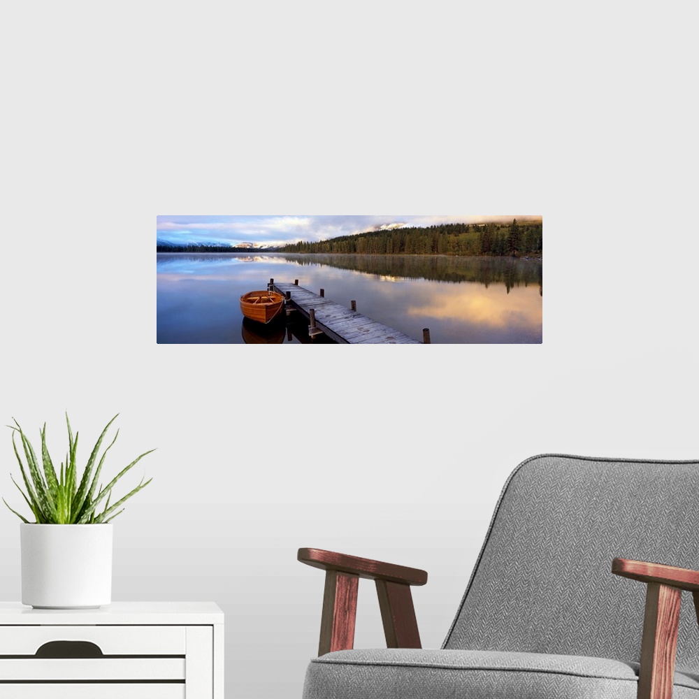 A modern room featuring Panoramic photograph of creek with canoe tied to a pier.  There are trees on both sides of the cr...