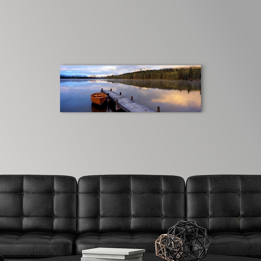 A modern room featuring Panoramic photograph of creek with canoe tied to a pier.  There are trees on both sides of the cr...
