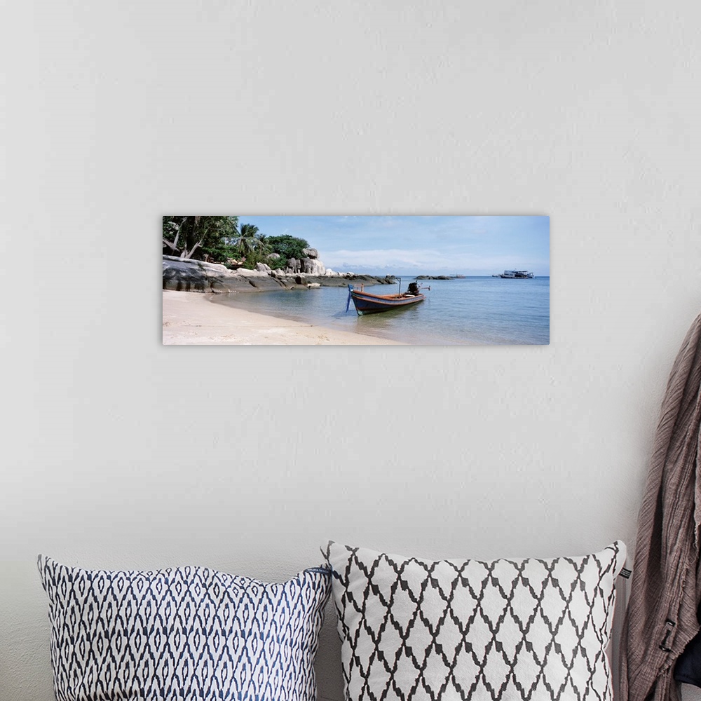 A bohemian room featuring Boat moored on the beach