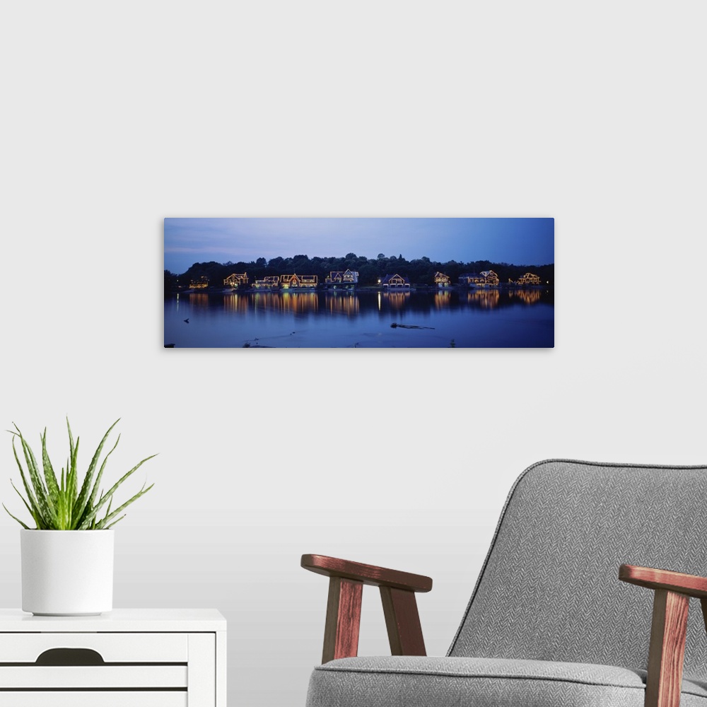 A modern room featuring Panoramic photo of Boathouse Row in Philadelphia, Pennsylvania (PA) at sundown. Lights on the hou...