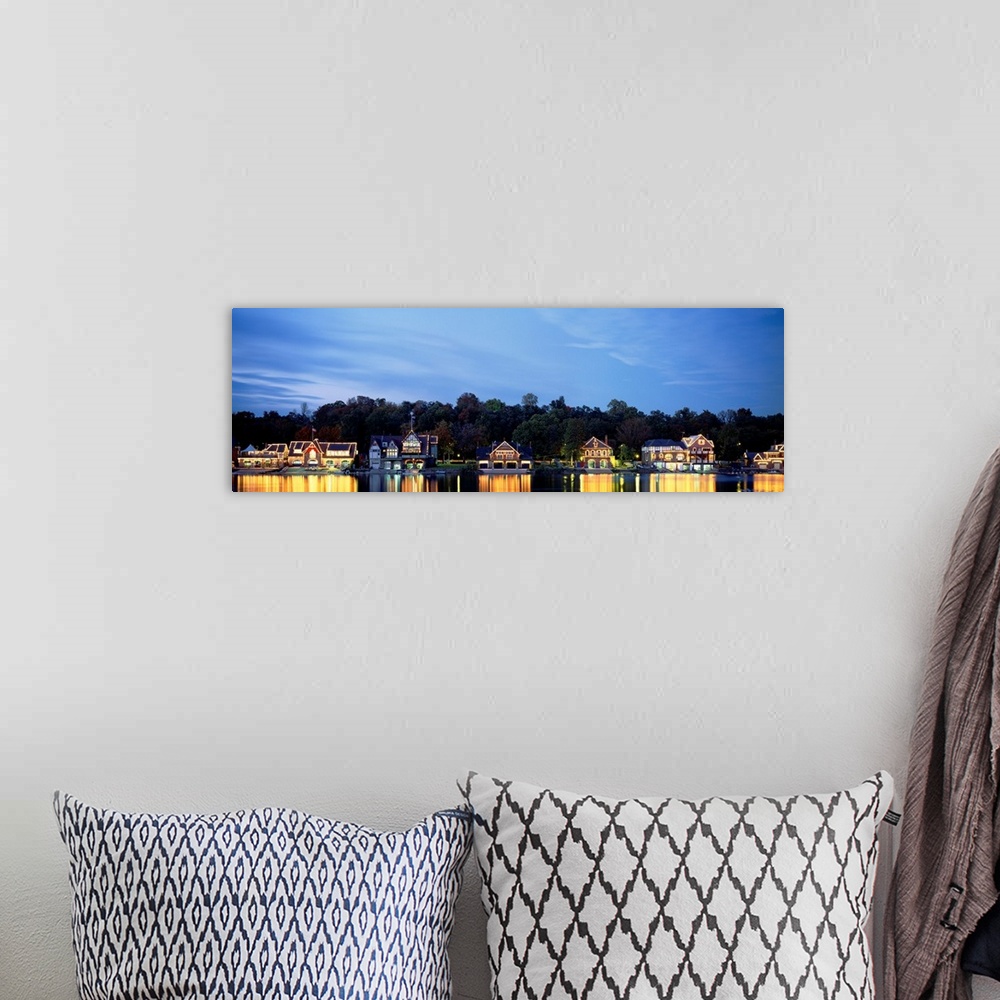 A bohemian room featuring Panoramic photograph taken of Boathouse Row in Philadelphia at night with a backdrop full of tree...