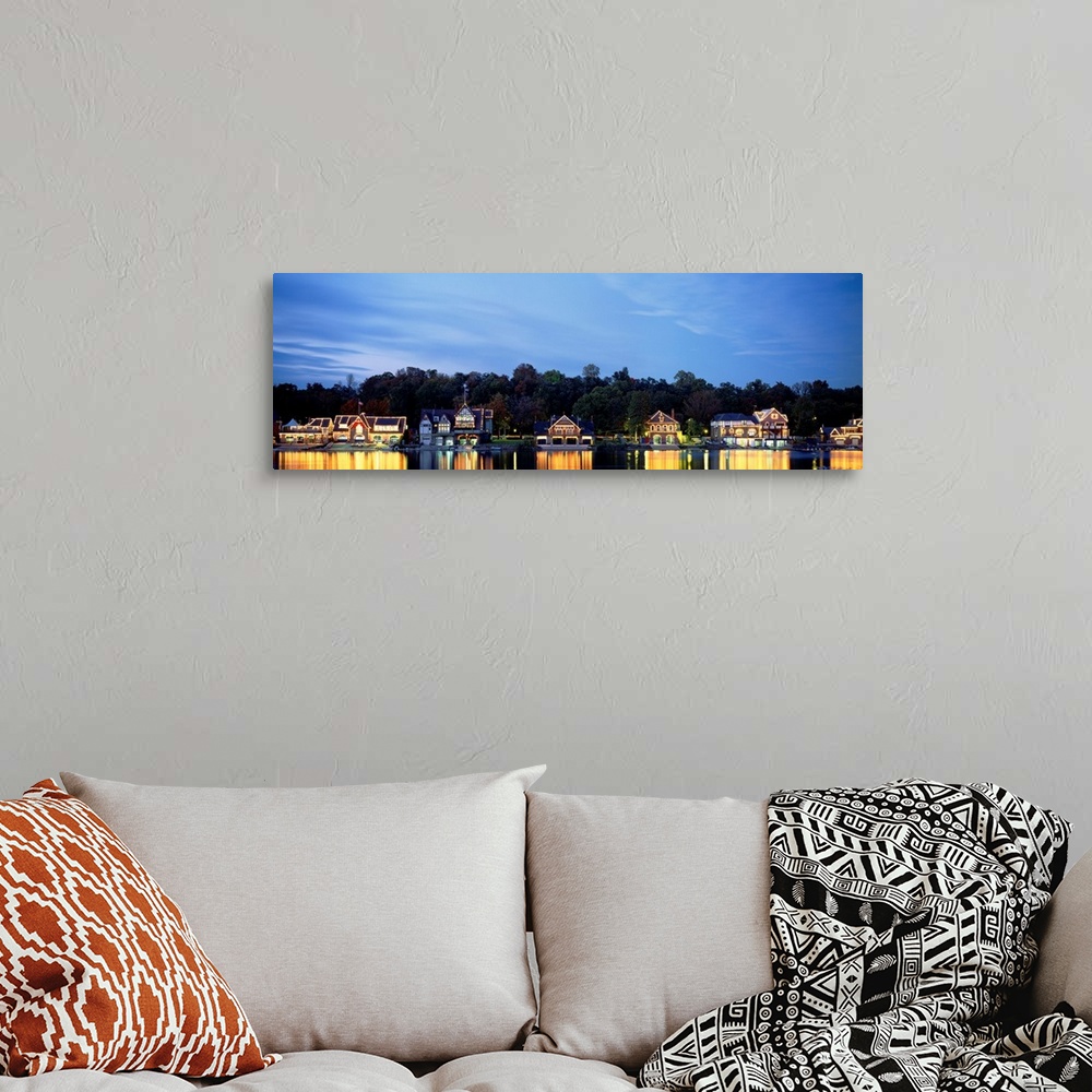 A bohemian room featuring Panoramic photograph taken of Boathouse Row in Philadelphia at night with a backdrop full of tree...