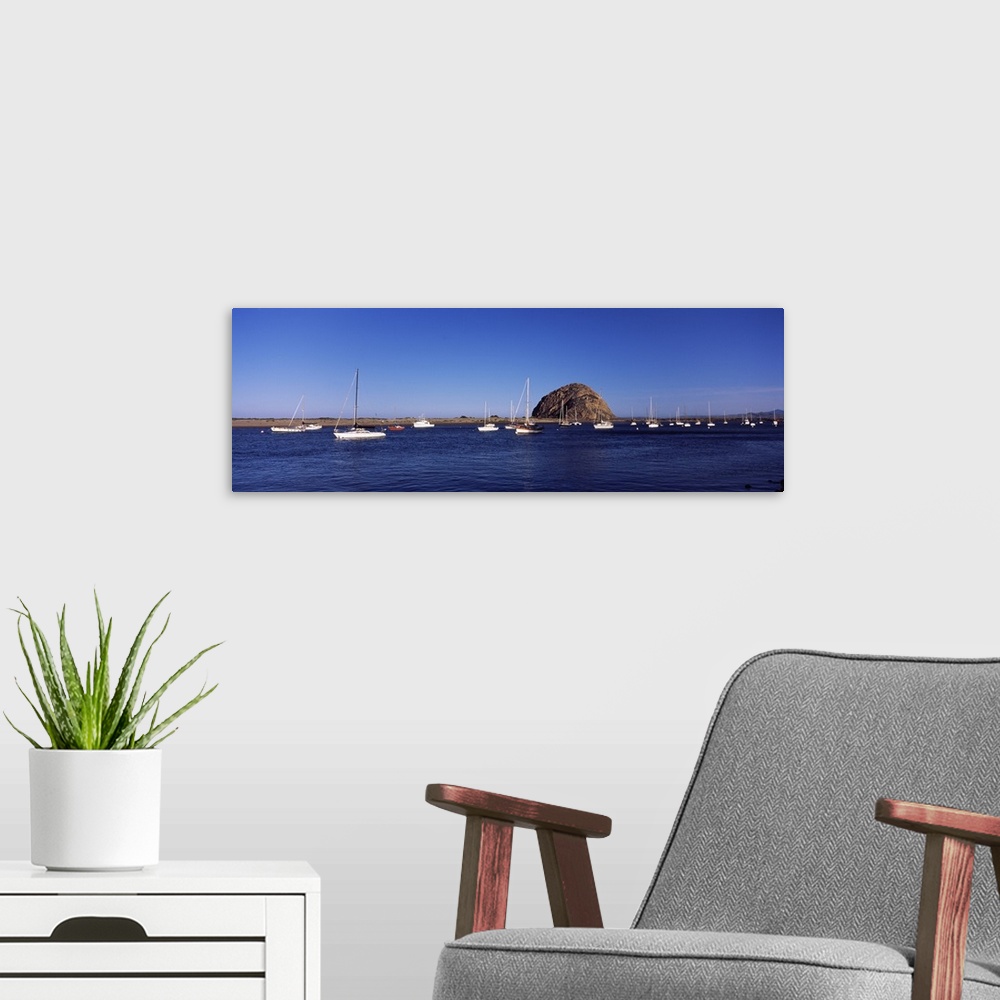A modern room featuring Boats at a harbor with rock in the background Morro Rock Morro Bay California