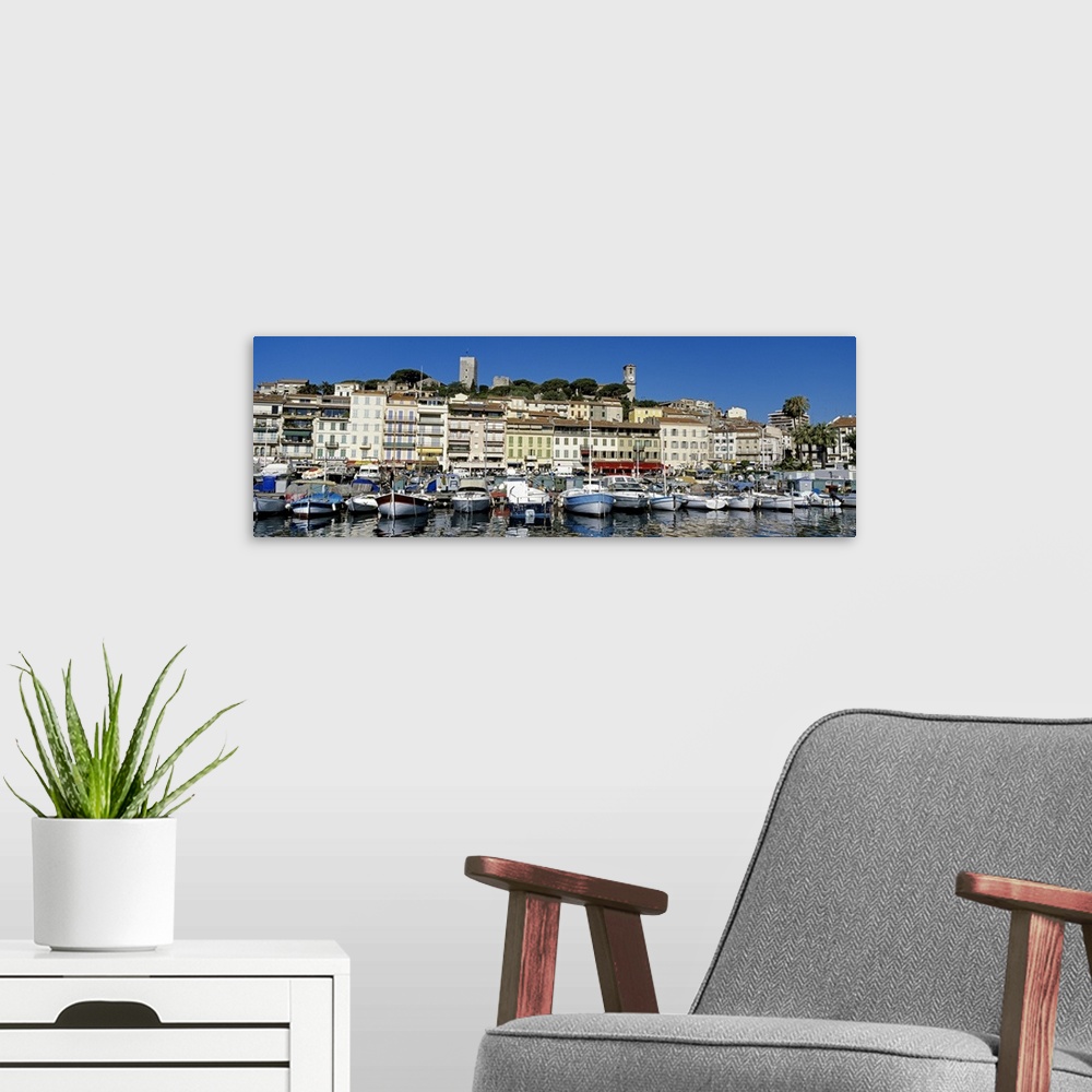 A modern room featuring Boats docked at a harbor, Cannes, French Riviera, France