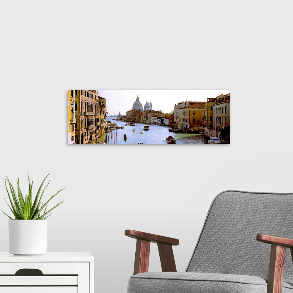 A modern room featuring Large panoramic photograph of the busy Grand Canal in Santa Maria della Salute, Venice, Veneto, I...