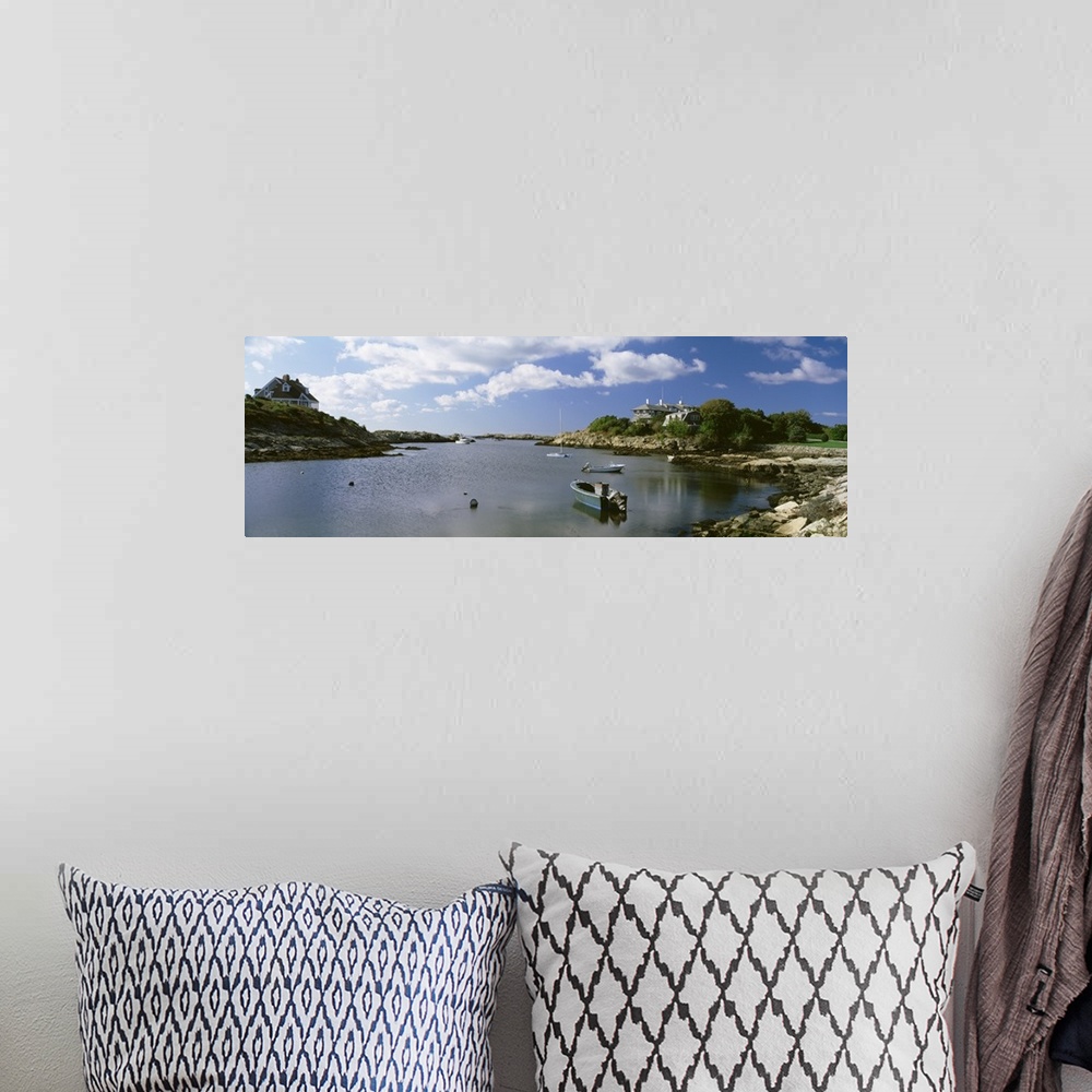 A bohemian room featuring Panoramic photograph on a big canvas of several small boats in ocean water, surrounded by rocky l...
