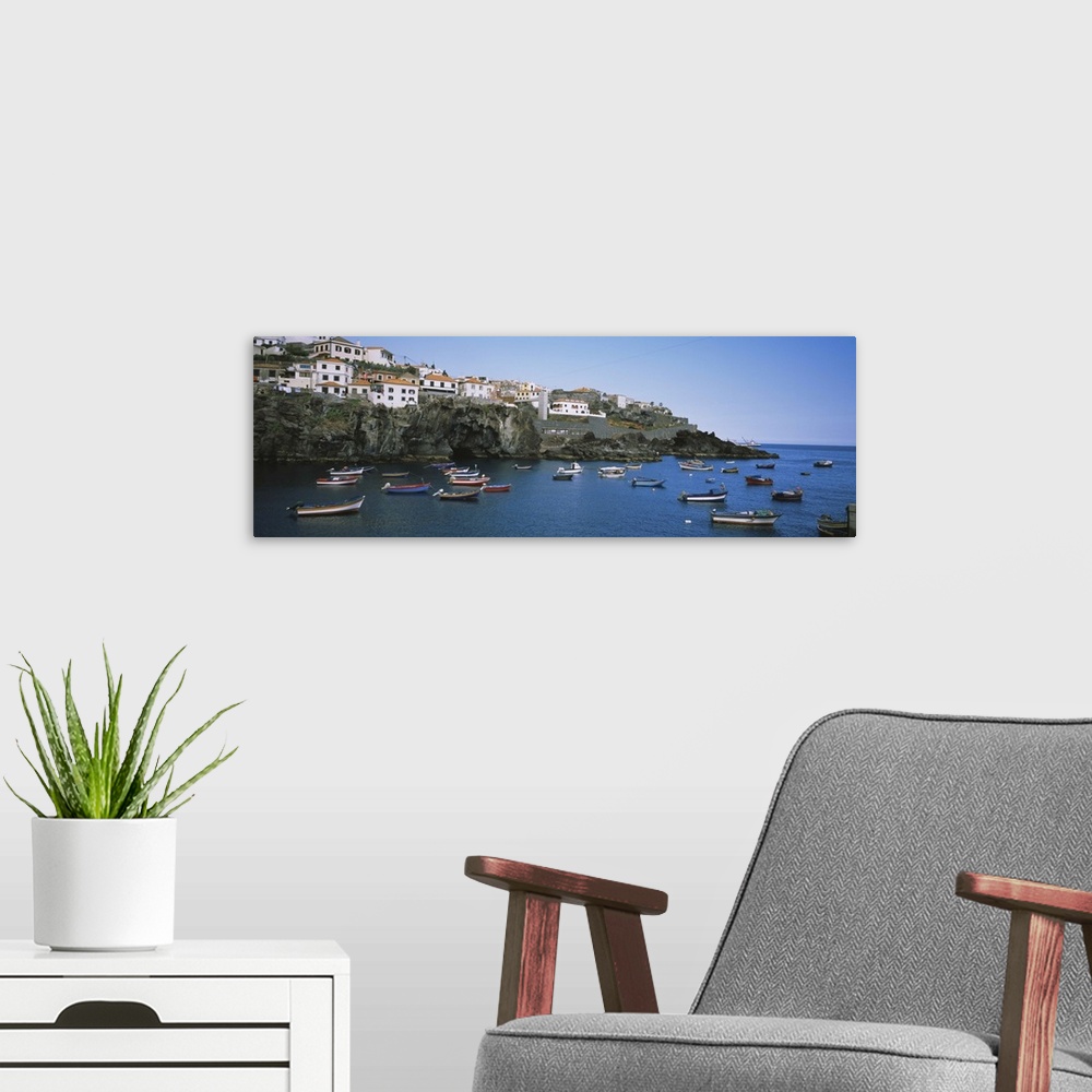 A modern room featuring Boats in the sea, Camara De Lobos, Madeira, Portugal