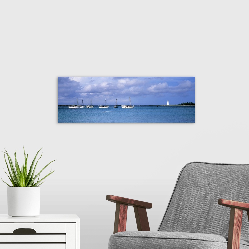 A modern room featuring Boats in the sea with a lighthouse in the background, Nassau Harbour Lighthouse, Nassau, Bahamas