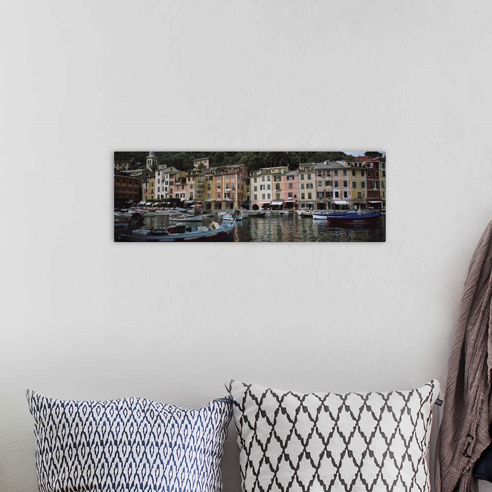A bohemian room featuring Panoramic photograph on a big canvas of a many boats anchored in the Italian Riviera harbor, a li...