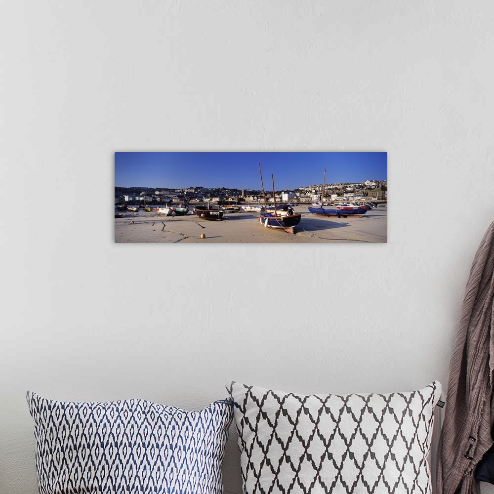 A bohemian room featuring Boats on the beach St. Ives Harbour Cornwall England