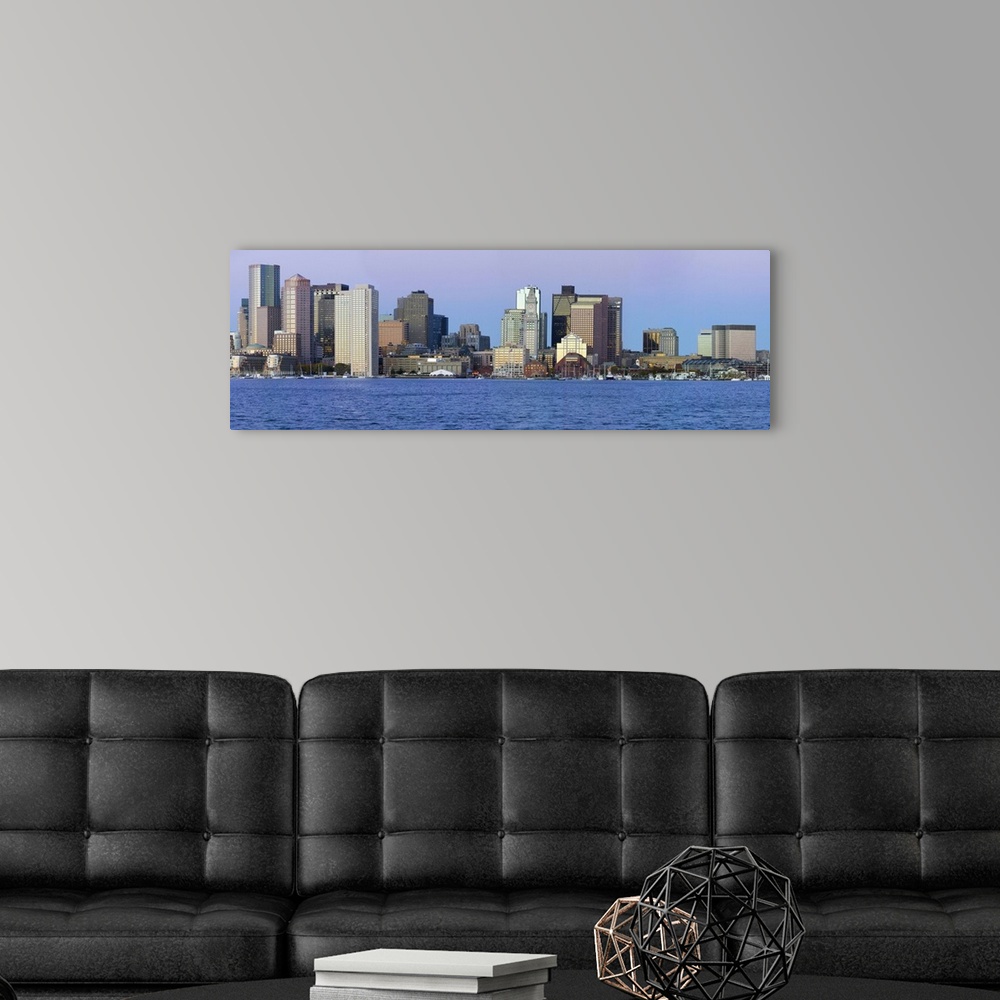 A modern room featuring Panoramic of Boston Harbor and the Boston skyline at sunrise as seen from South Boston, Massachus...