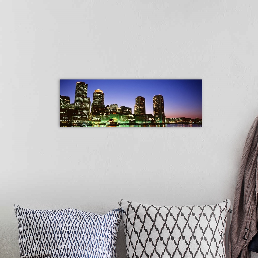 A bohemian room featuring Long and horizontal canvas photo of some skyscrapers in Boston lit up at night and reflected on t...