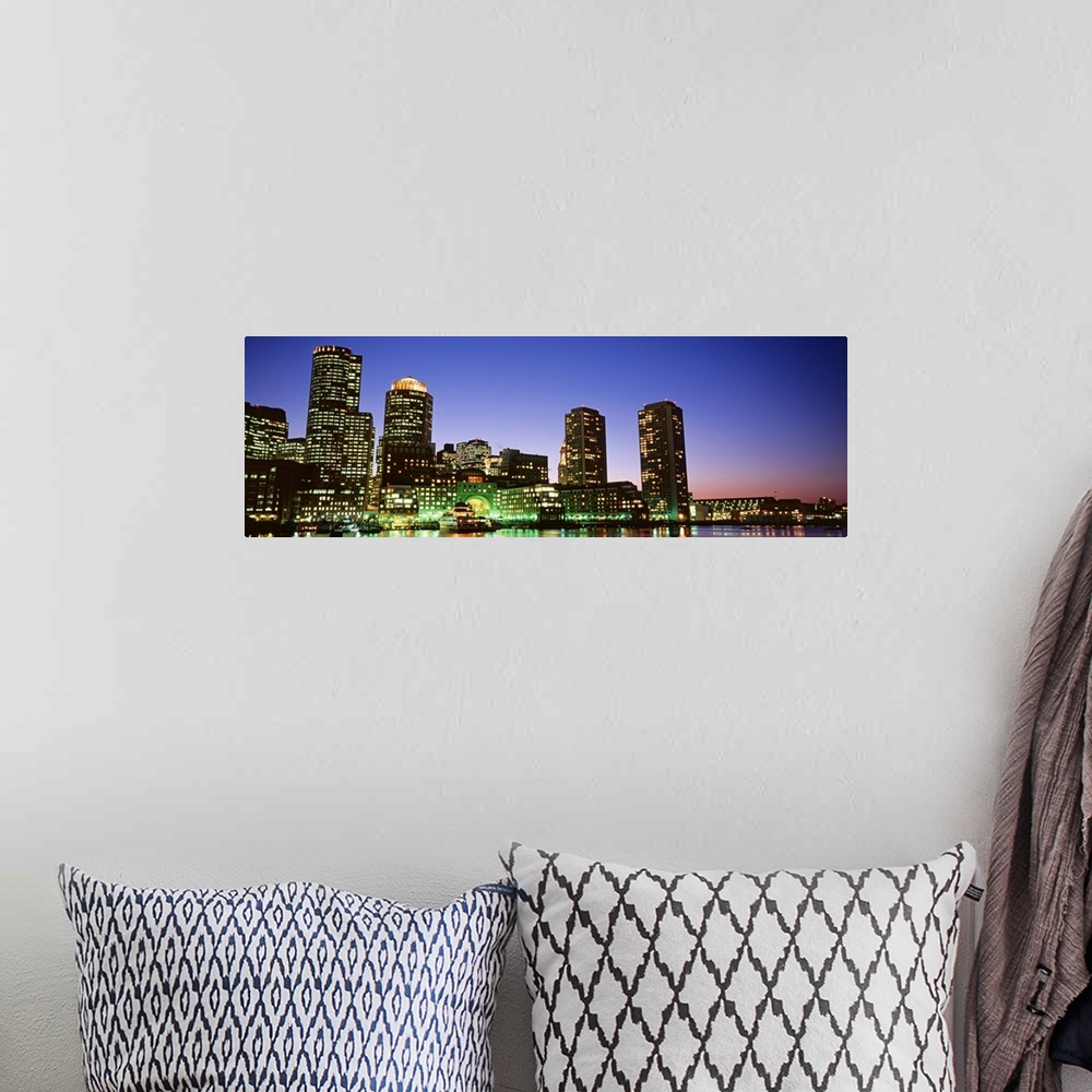 A bohemian room featuring Long and horizontal canvas photo of some skyscrapers in Boston lit up at night and reflected on t...