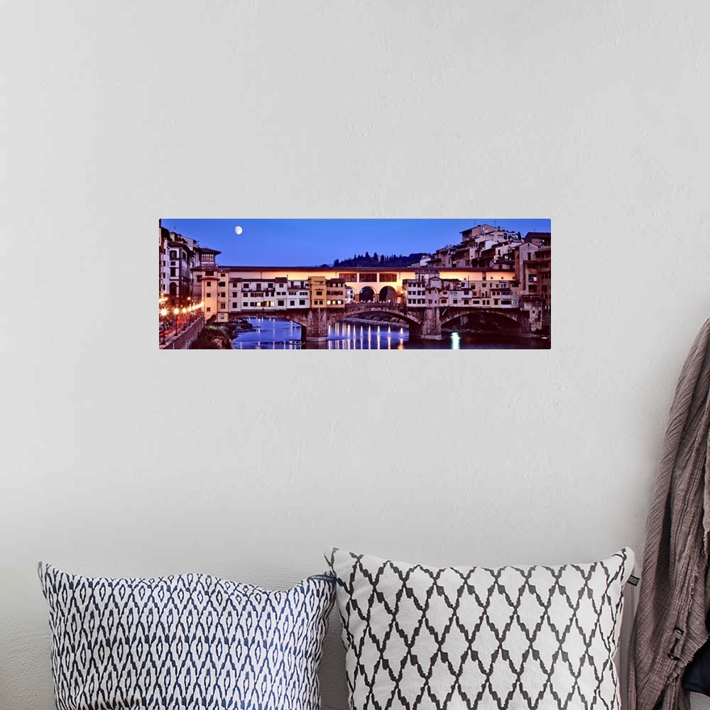 A bohemian room featuring Panoramic photograph focuses on an overpass as it spans a wide river and the moon shines bright o...
