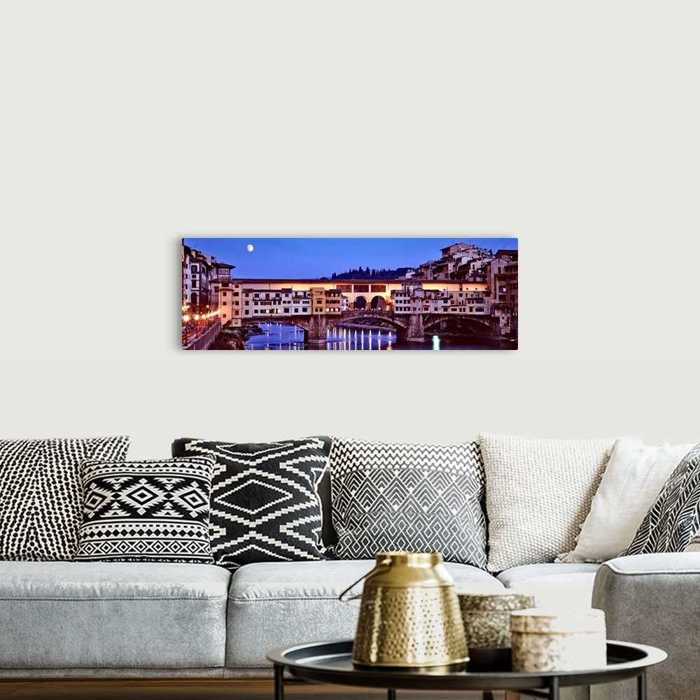 A bohemian room featuring Panoramic photograph focuses on an overpass as it spans a wide river and the moon shines bright o...