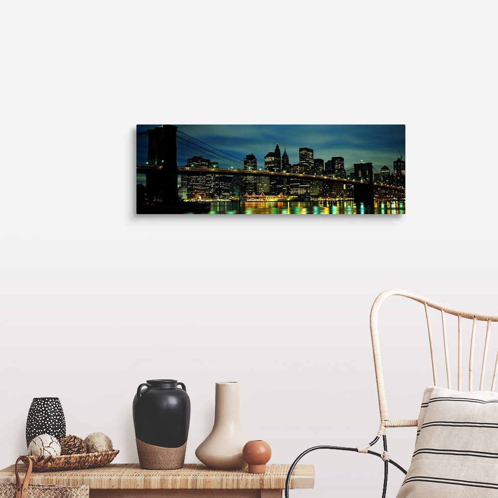 A farmhouse room featuring A panoramic photograph of Manhattan harbor lights reflecting in the East River at night.