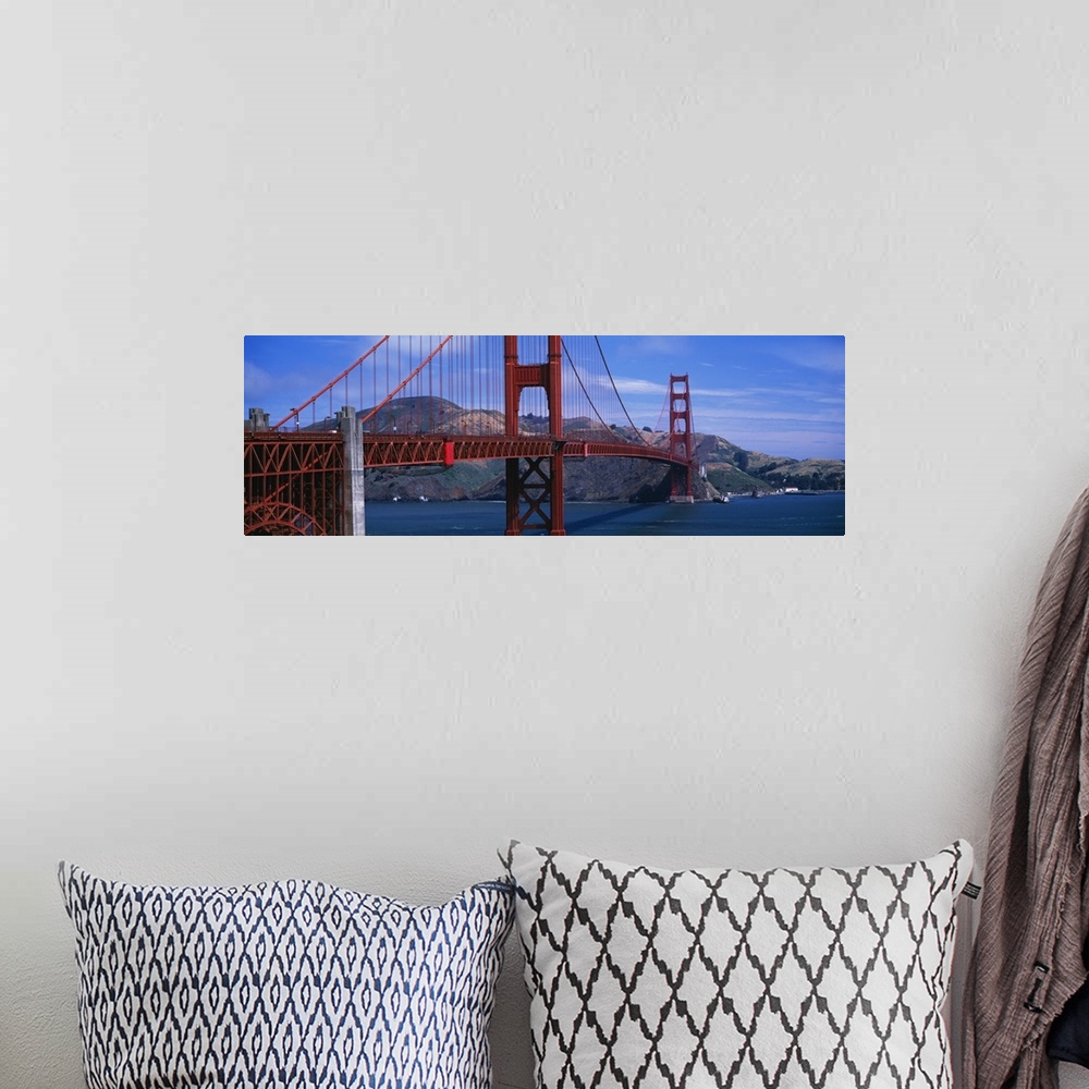 A bohemian room featuring Panoramic photo featuring an angled view of the Golden Gate Bridge over the Pacific Ocean in San ...
