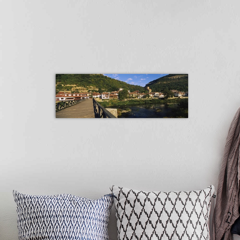 A bohemian room featuring Bridge across a river with a city in the background Veliko Tarnovo Bulgaria