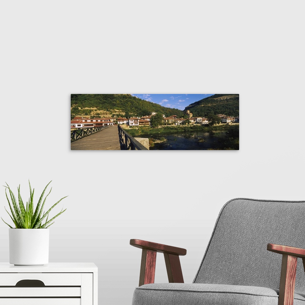 A modern room featuring Bridge across a river with a city in the background Veliko Tarnovo Bulgaria