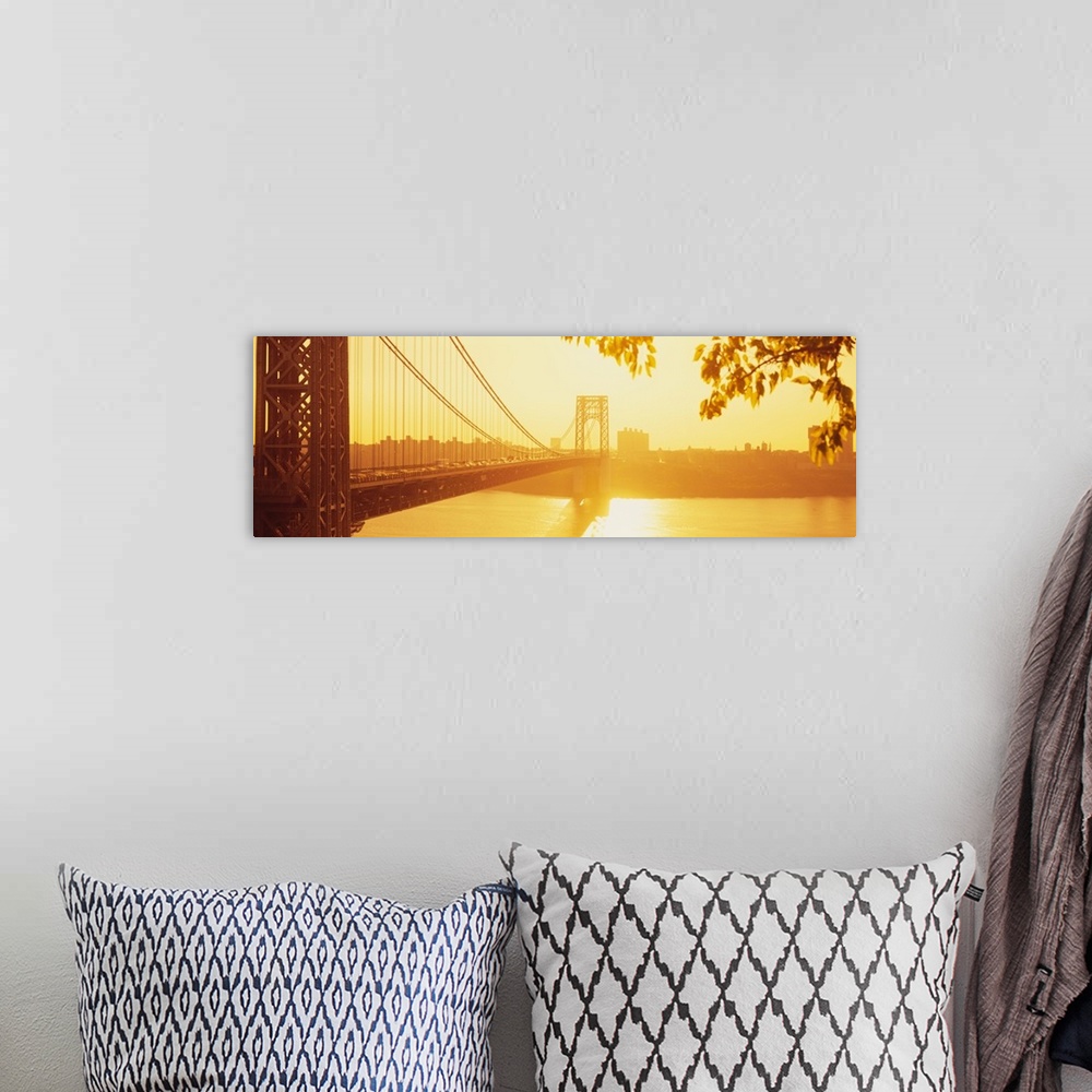 A bohemian room featuring Panorama photograph taken of the George Washington bridge during sun down which gives the picture...