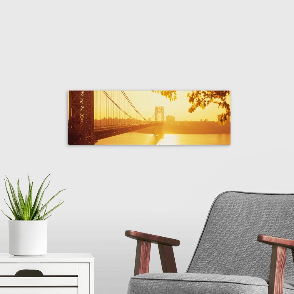 A modern room featuring Panorama photograph taken of the George Washington bridge during sun down which gives the picture...
