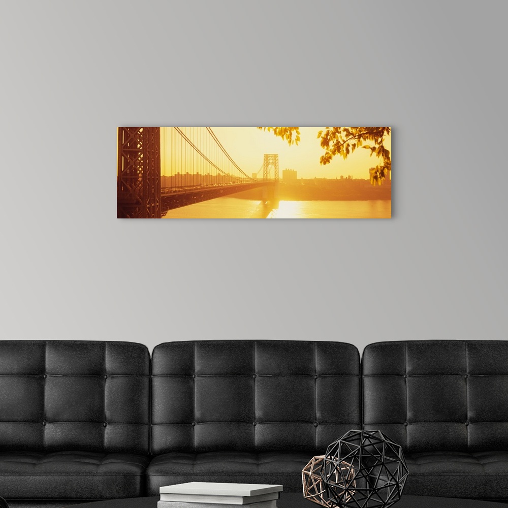 A modern room featuring Panorama photograph taken of the George Washington bridge during sun down which gives the picture...