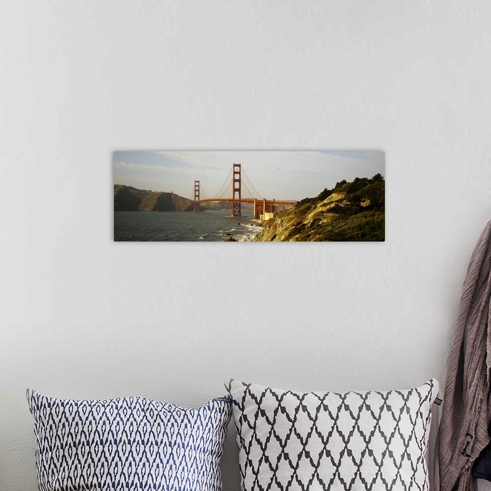 A bohemian room featuring San Francisco panoramic of Golden Gate bridge with view of the bay and rocky coast.