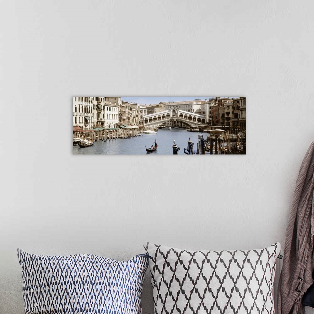 A bohemian room featuring Panoramic photograph taken of a walking bridge over a canal in Italy with gondola boat docks lini...