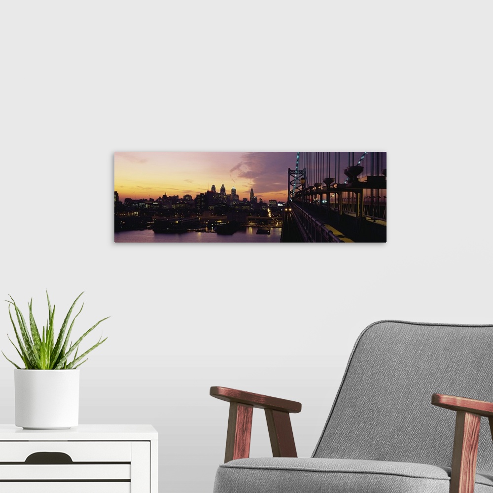 A modern room featuring Panoramic photograph shows skyscrapers in lively city within the Northeastern United States start...