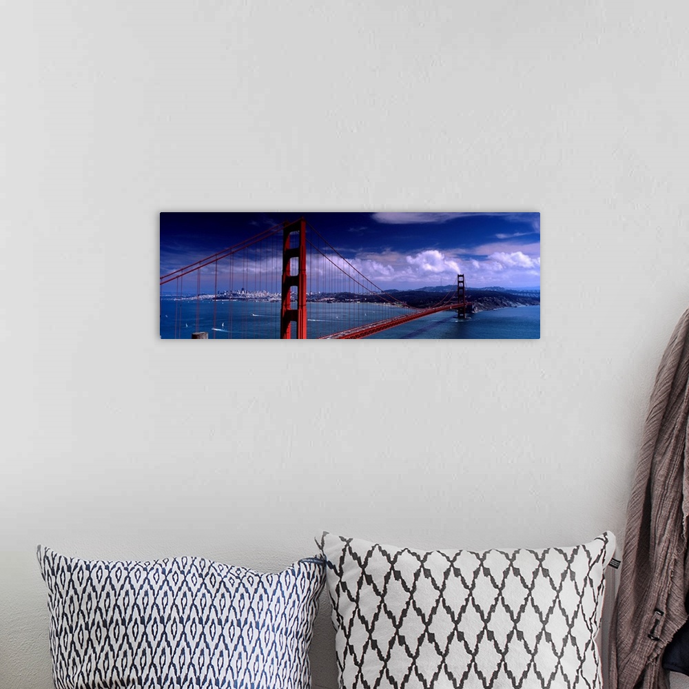 A bohemian room featuring Panoramic photograph of the suspension bridge over the mouth of the bay on a sunny day as clouds ...