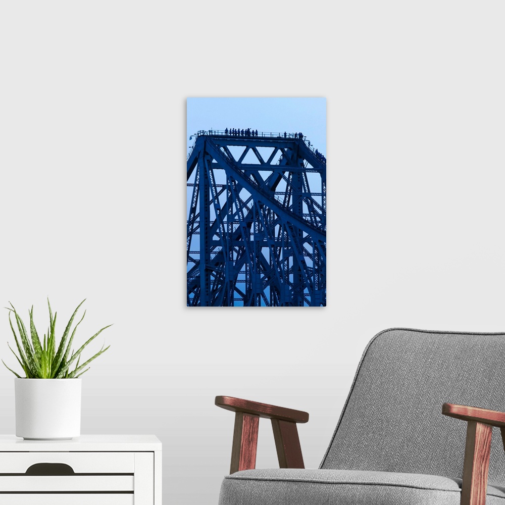 A modern room featuring Bridgewalkers standing on Story Bridge, Brisbane River, Queensland, Australia