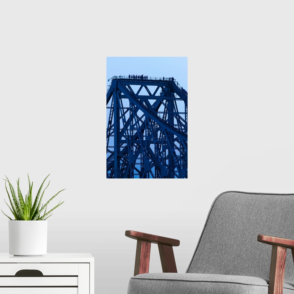 A modern room featuring Bridgewalkers standing on Story Bridge, Brisbane River, Queensland, Australia