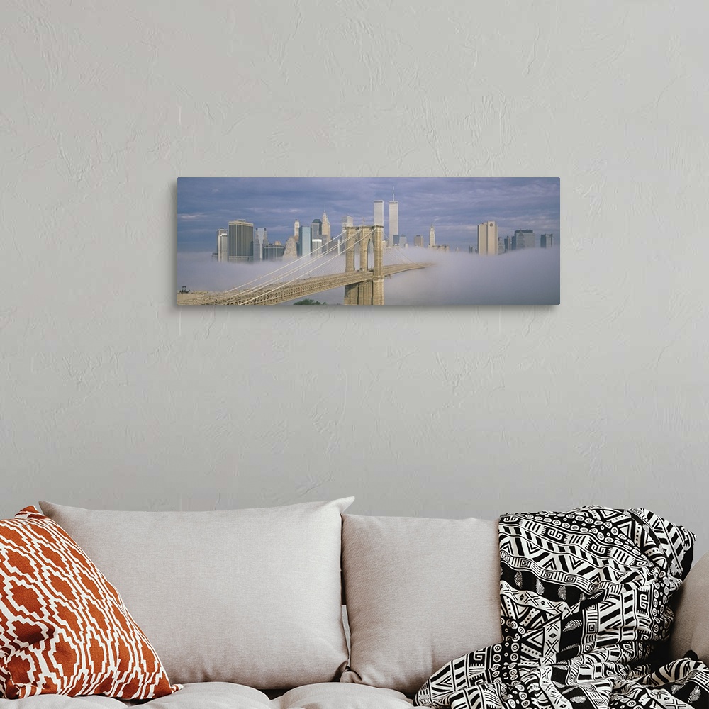 A bohemian room featuring Panoramic photo on canvas of a bridge leading to the NYC skyline poking out of the fog.