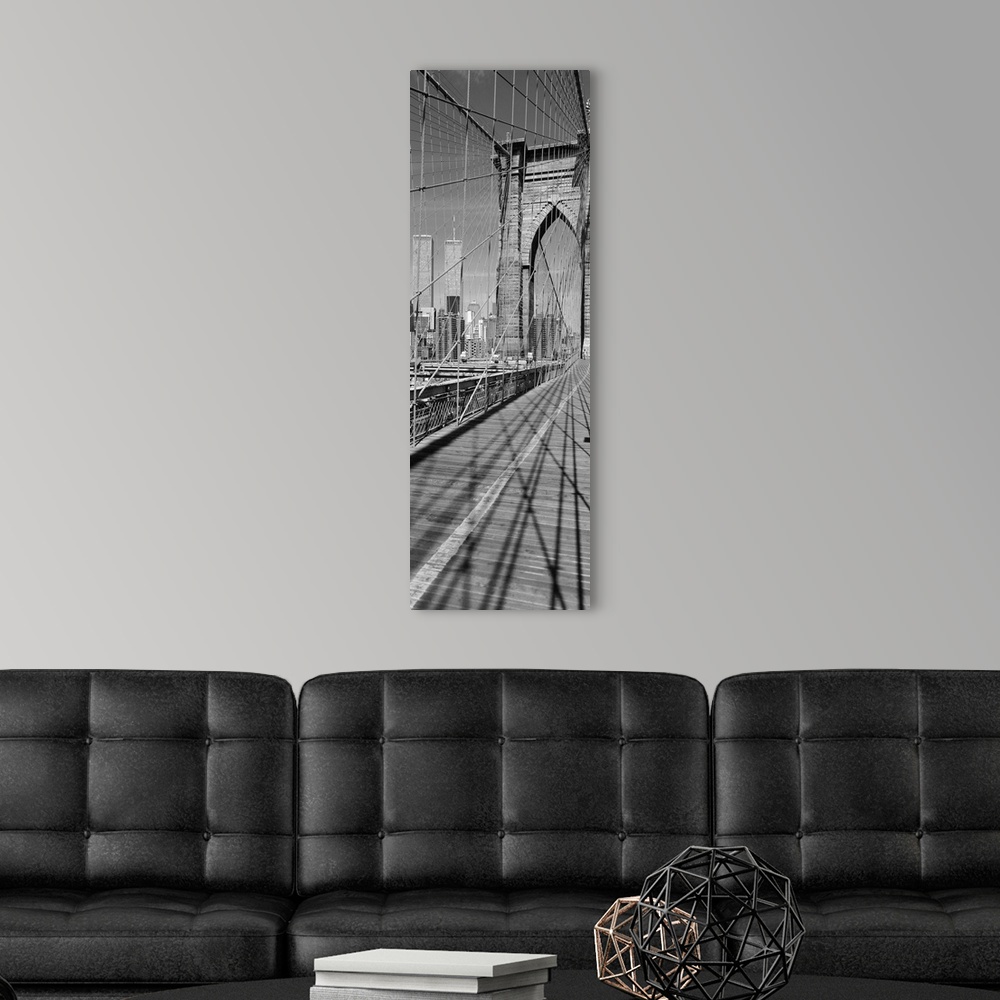 A modern room featuring This vertical panoramic shaped photograph taken before 2001 shows one of the suspension towers of...