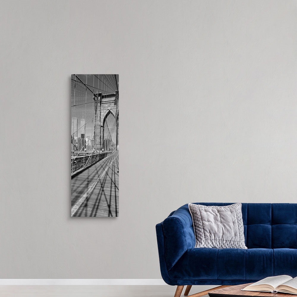 A modern room featuring This vertical panoramic shaped photograph taken before 2001 shows one of the suspension towers of...