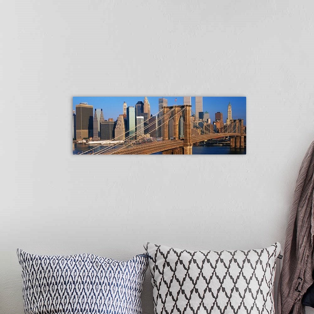 A bohemian room featuring Panoramic photograph of overpass with skyline in the background under a clear sky.