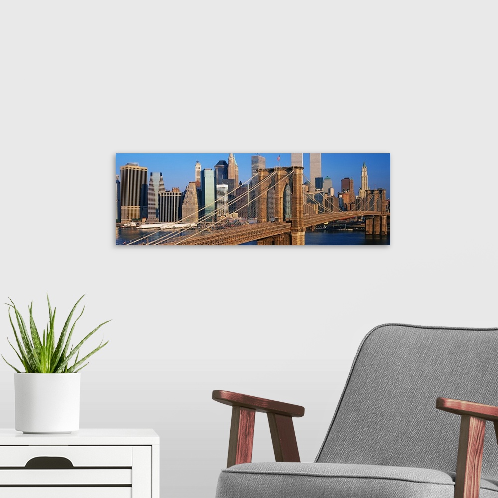 A modern room featuring Panoramic photograph of overpass with skyline in the background under a clear sky.