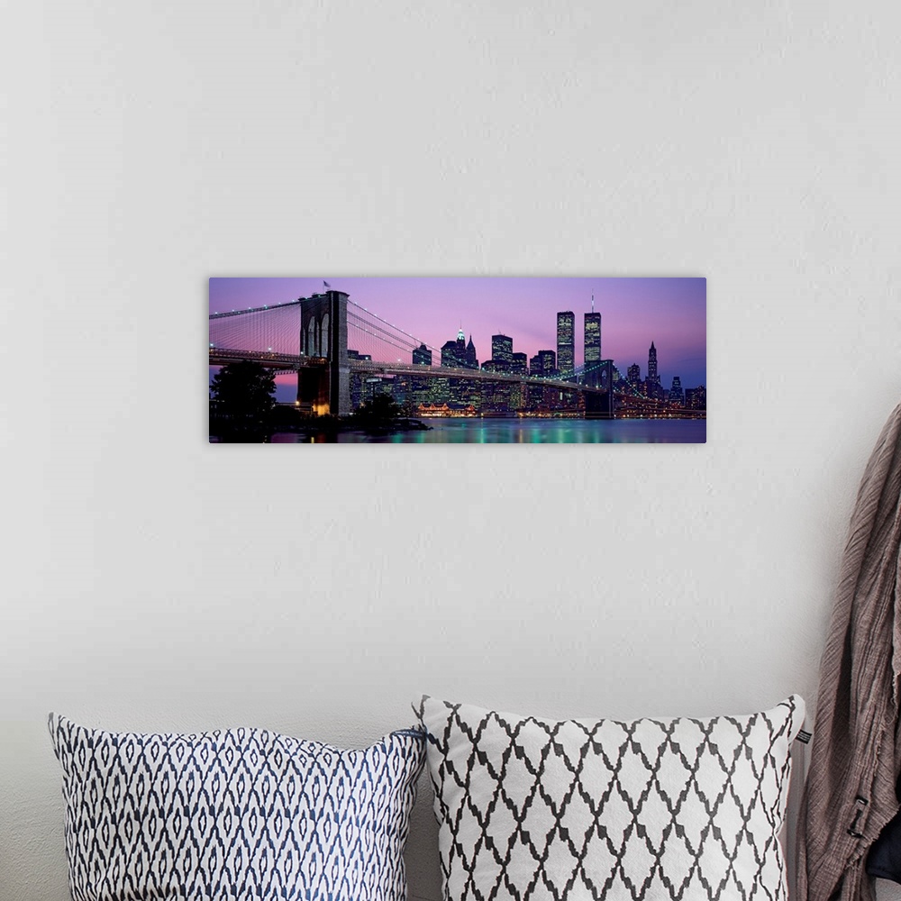 A bohemian room featuring Panoramic photograph shows the Brooklyn Bridge in New York, New York spanning over the East River...