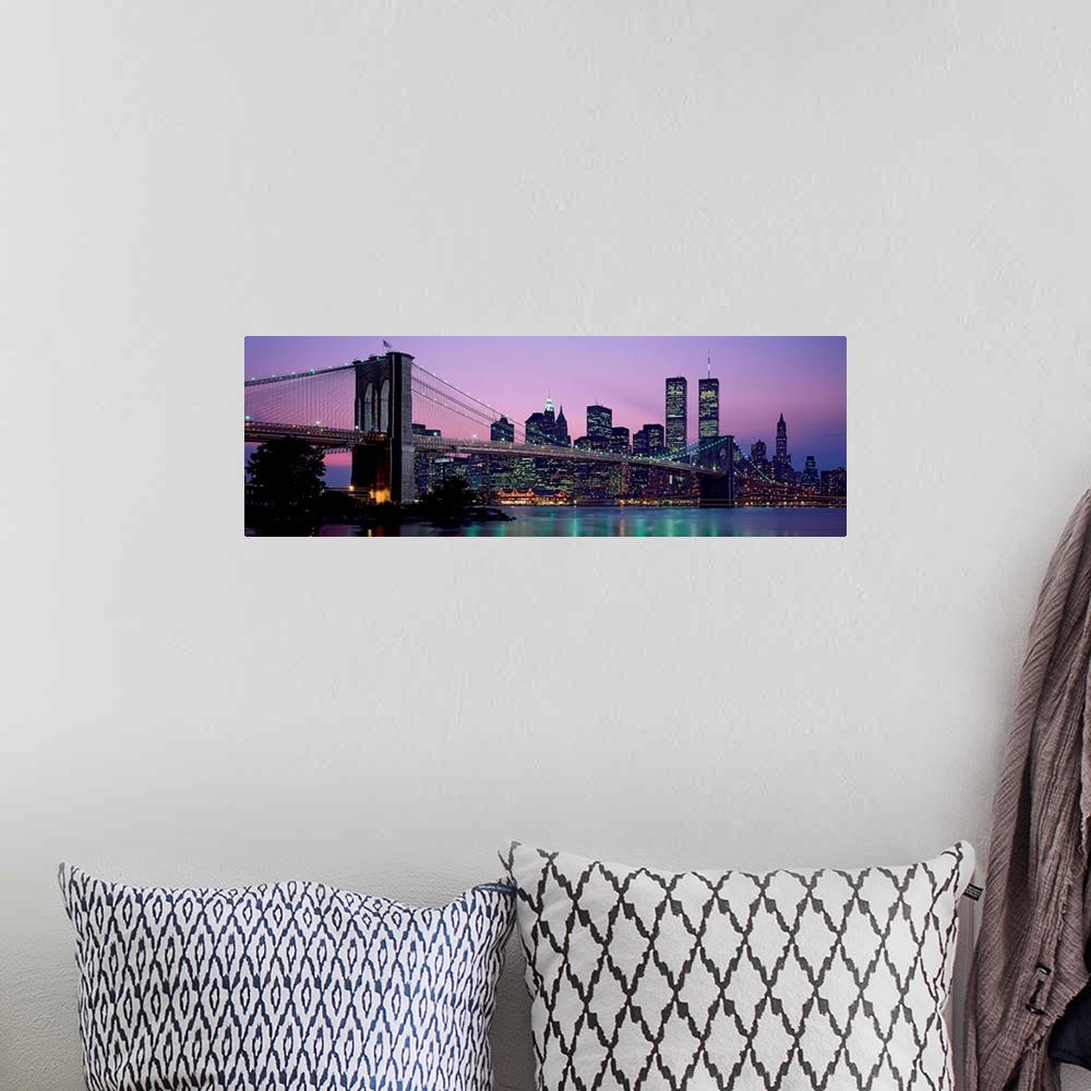 A bohemian room featuring Panoramic photograph shows the Brooklyn Bridge in New York, New York spanning over the East River...
