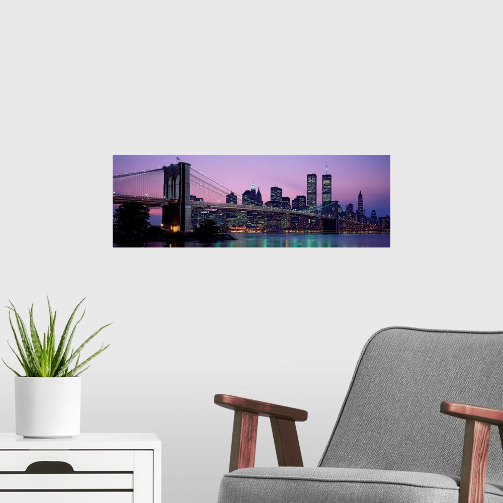 A modern room featuring Panoramic photograph shows the Brooklyn Bridge in New York, New York spanning over the East River...